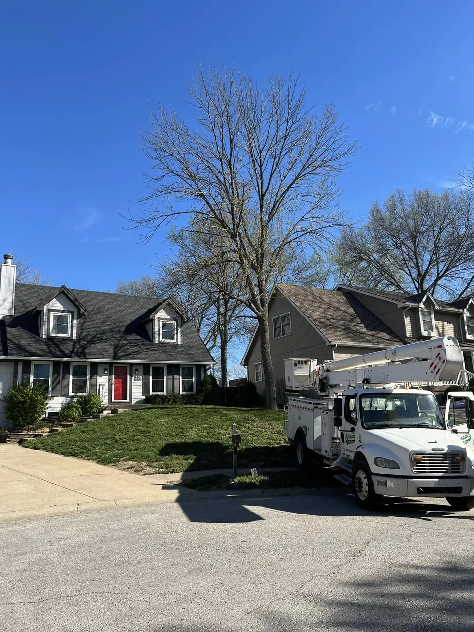 Bucket truck at residential property for tree service